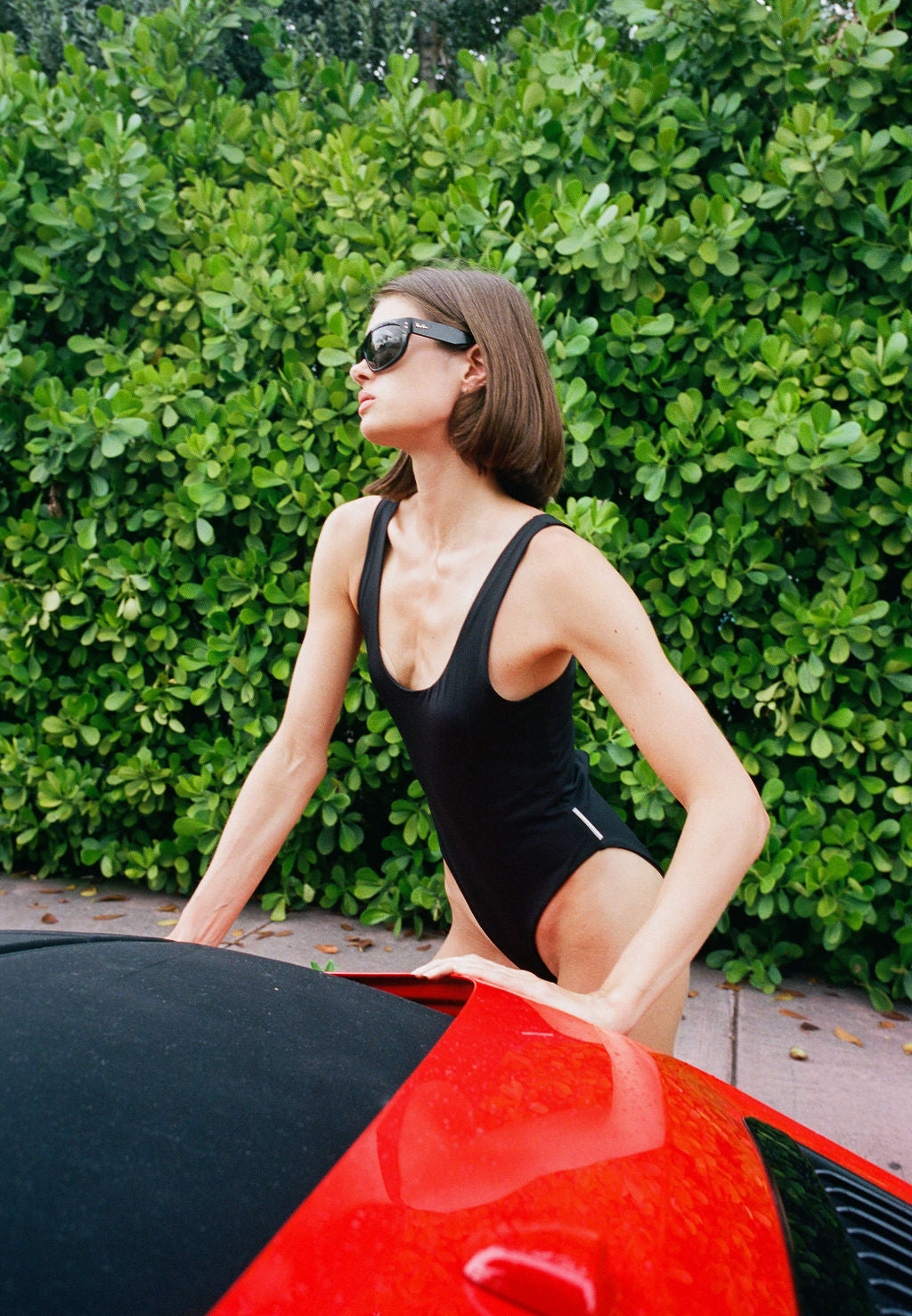 Teardrop one-piece in Neon Noir, editorial
