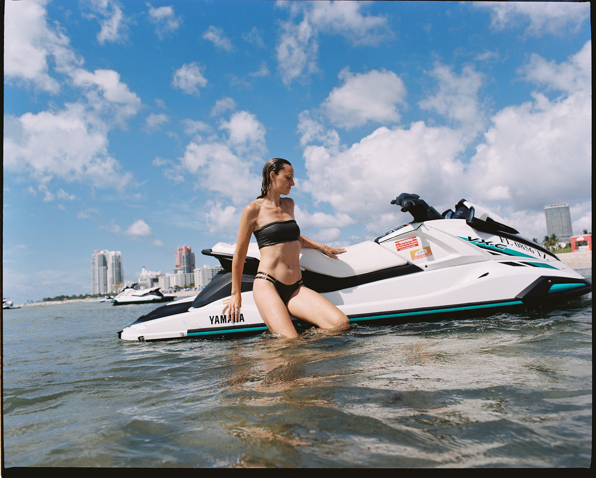 Little Runaway set in Neon Noir, editorial in the water